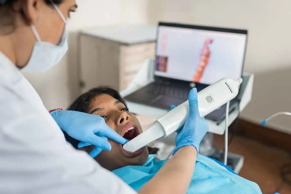 Dentist taking a 3D digital scan for dental crown treatment