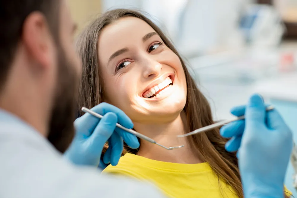 Patient smiling during a routine dental hygiene appointment