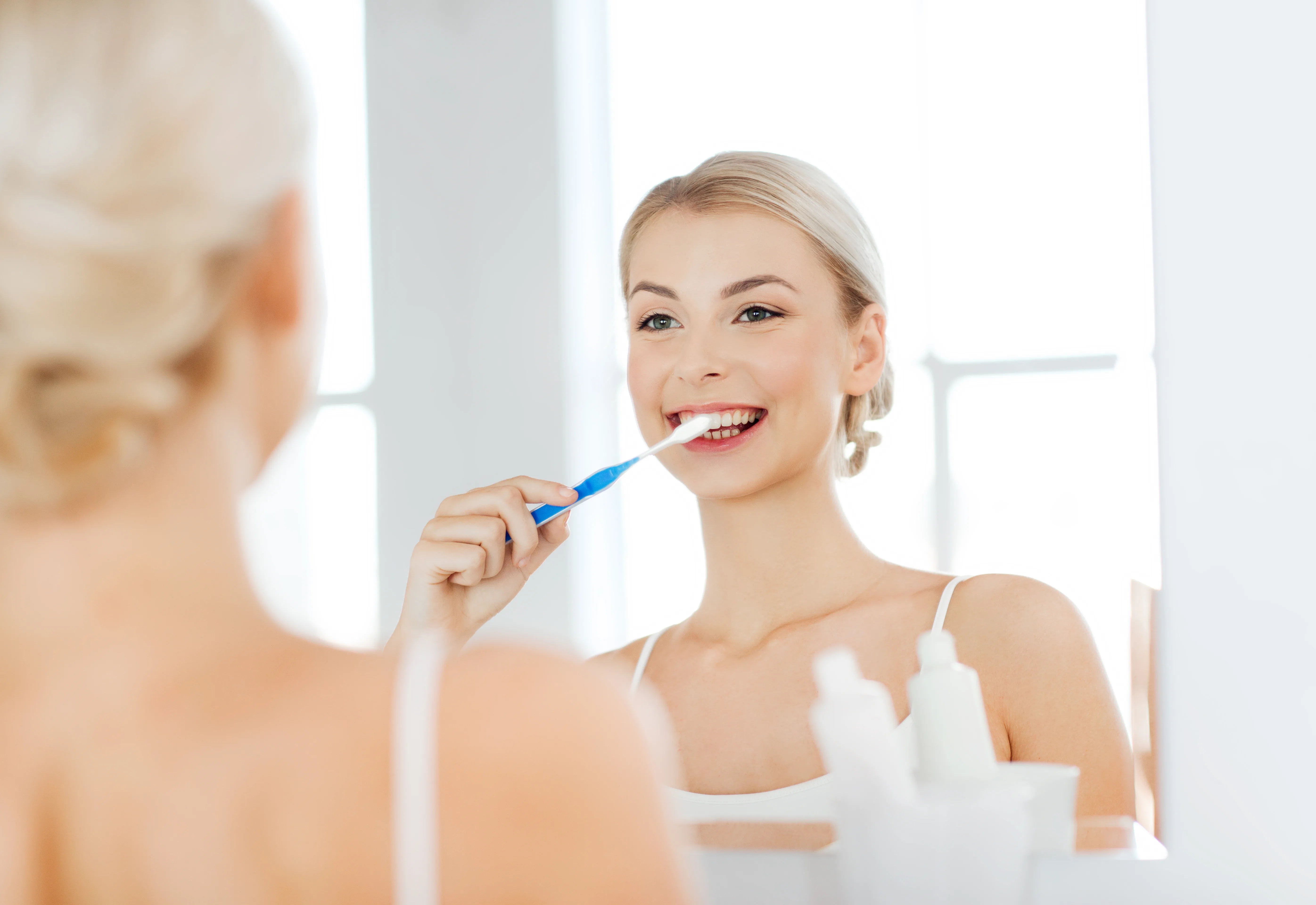 Airflow polishing tip in use during dental hygiene appointment